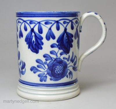 Pearlware pottery mug decorated with blue under the glaze, circa 1820