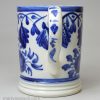 Pearlware pottery mug decorated with blue under the glaze, circa 1820