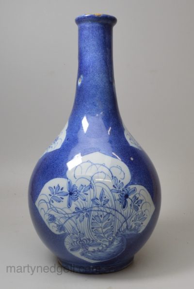 London delft bottle decorated with a powder blue ground, circa 1750