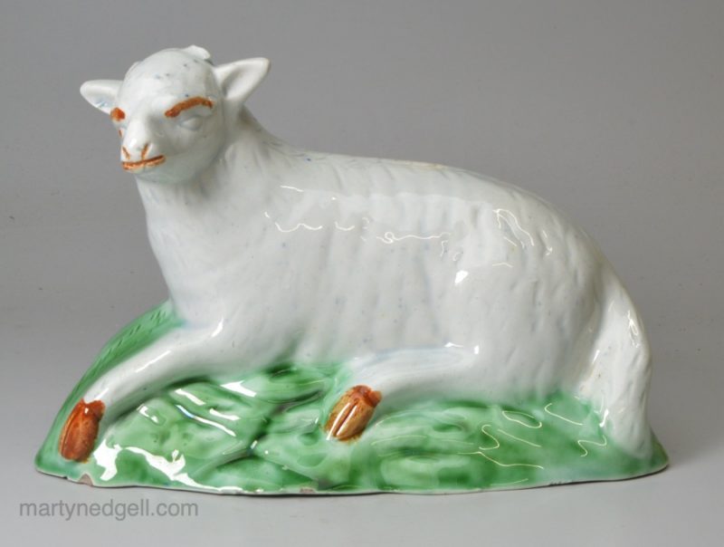 Pearlware pottery sheep, decorated with coloured oxides under the glaze, circa 1790