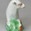 Pearlware pottery sheep, decorated with coloured oxides under the glaze, circa 1790