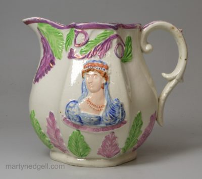 Pearlware pottery commemorative jug moulded with Princess Charlotte and Prince Leopold, circa 1817