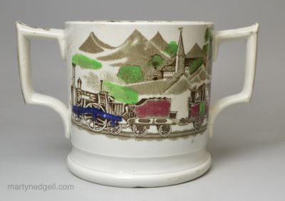 Pearlware pottery loving cup printed with a railway train, circa 1850