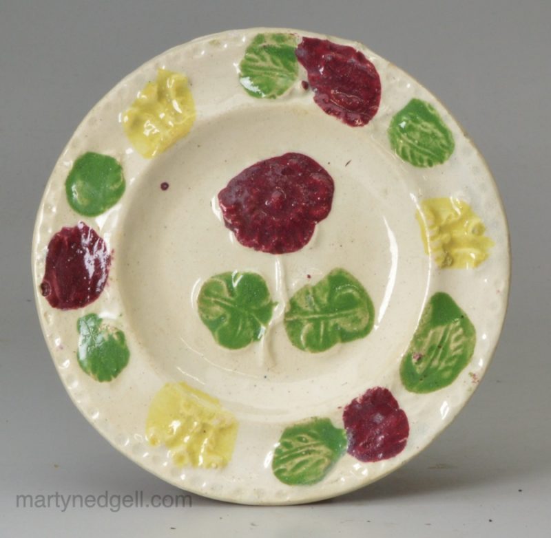 Pearlware pottery child's toy plate moulded with flowers, circa 1820