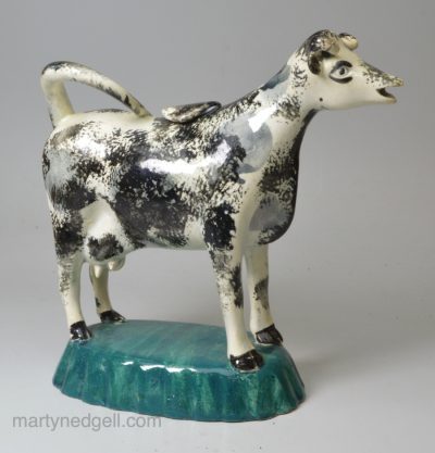 Pearlware pottery cow creamer decorated with enamels under the glaze, circa 1820, Possibly Scottish or North East