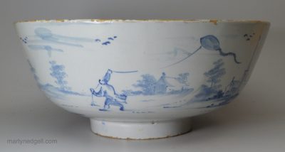 London delft bowl painted with a man flying a kite, circa 1750