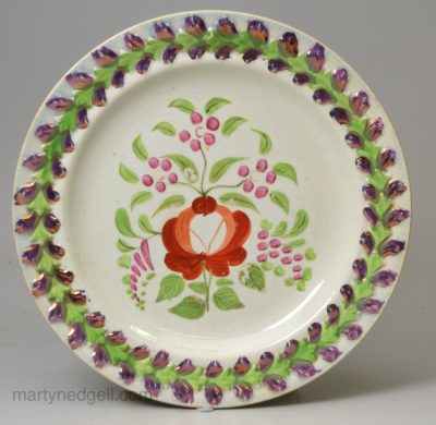 Small pearlware porttery plate decorated with enamels and pink lustre over the glaze, circa 1820