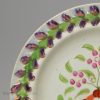 Small pearlware porttery plate decorated with enamels and pink lustre over the glaze, circa 1820