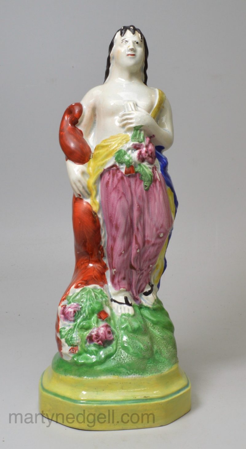 Staffordshire pearlware pottery figure of plenty, circa 1810