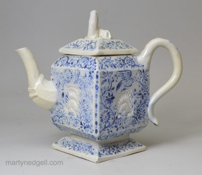 Staffordshire white salt glaze stoneware teapot decorated with blue inlaid into the pattern, circa 1750