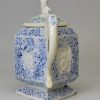 Staffordshire white salt glaze stoneware teapot decorated with blue inlaid into the pattern, circa 1750