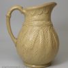 Buff coloured stoneware jug moulded with wheat ears, circa 1850