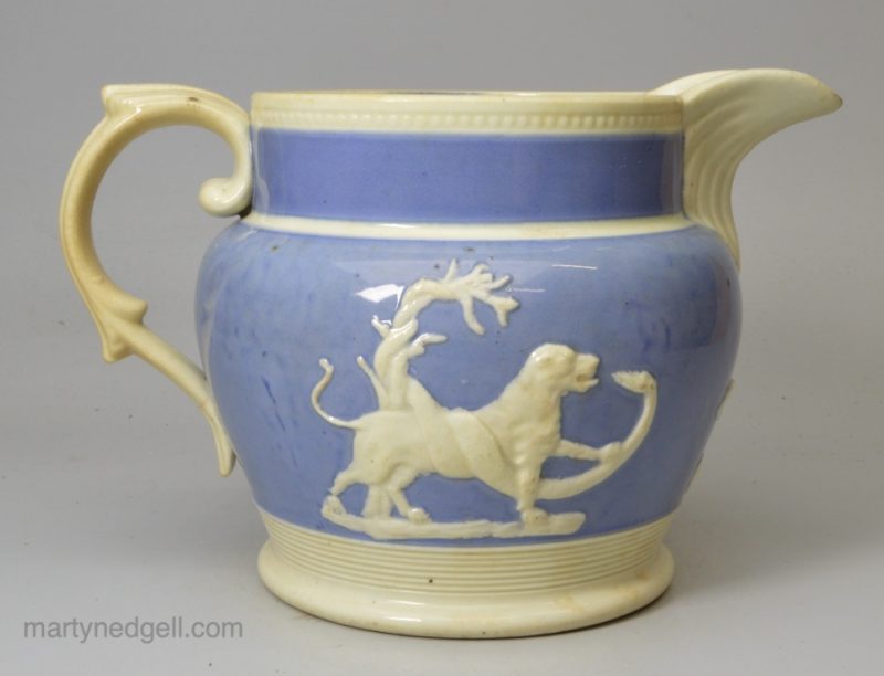 Pearlware pottery jug decorated with blue slip and applied sprigs, circa 1830