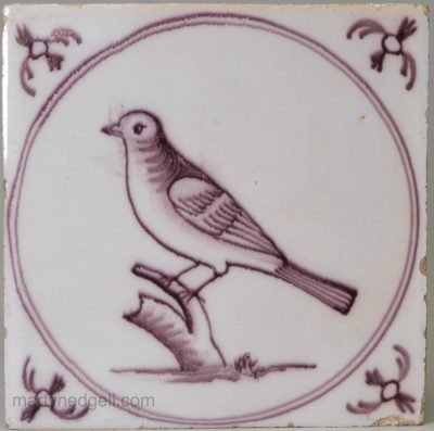 Liverpool delft tile decorated in manganese with a bird, circa 1760