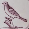 Liverpool delft tile decorated in manganese with a bird, circa 1760