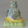 Creamware pottery cat with sponged decoration under the glaze, circa 1820