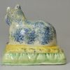 Creamware pottery cat with sponged decoration under the glaze, circa 1820