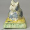 Creamware pottery cat with sponged decoration under the glaze, circa 1820