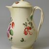 Creamware pottery milk jug and cover decorated with enamels over the glaze, circa 1780, probably Leeds Pottery