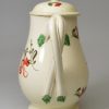 Creamware pottery milk jug and cover decorated with enamels over the glaze, circa 1780, probably Leeds Pottery