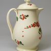 Creamware pottery milk jug and cover decorated with enamels over the glaze, circa 1780, probably Leeds Pottery