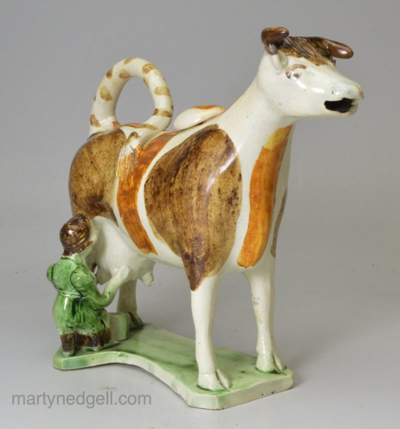 Pearlware pottery cow creamer decorative with oxides under the glaze, circa 1820