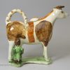 Pearlware pottery cow creamer decorative with oxides under the glaze, circa 1820