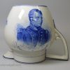 Rare syphoning pearlware pottery commemorative puzzle jug with blue prints of Napoleon and Wellington under the glaze, circa 1815