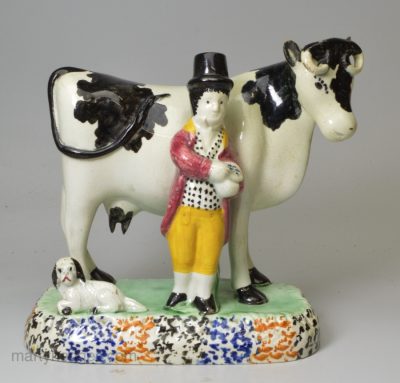 Prattware pottery cow group, circa 1820, Yorkshire pottery type