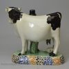 Prattware pottery cow group, circa 1820, Yorkshire pottery type