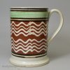 Mochaware pottery mug with slip decoration, circa 1820