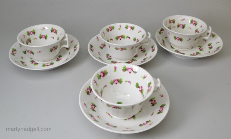 Set of four children's porcelain toy cups and saucers, circa 1840