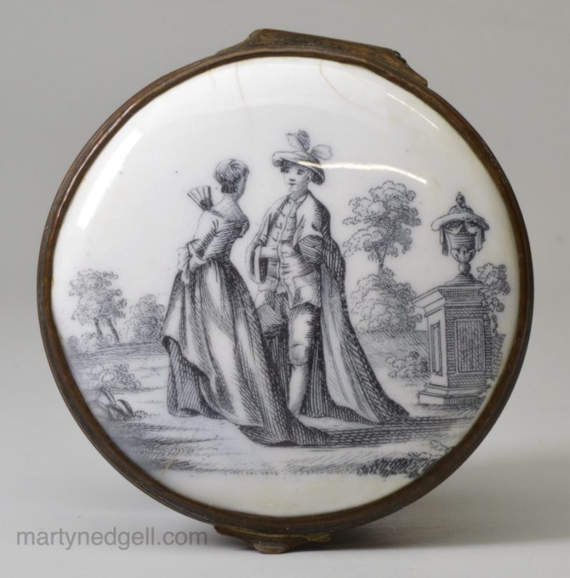 Birmingham enamel snuff box decorated with a print of a couple in a garden, circa 1770