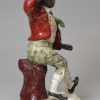 Staffordshire porcelain figure of T. E. Rice in the part of Jump Jim Crow, circa 1840