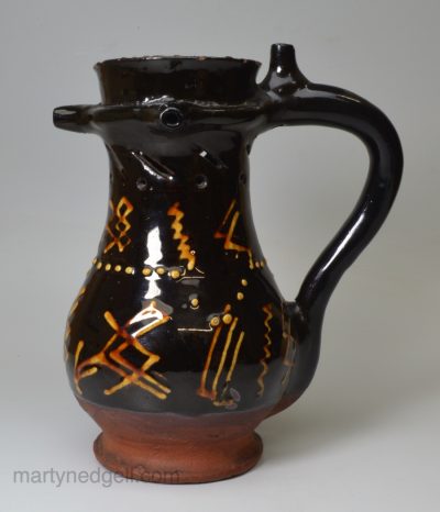 Slipware pottery puzzle jug, circa 1740