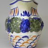 Prattware pottery jug moulded with vine leaves and grapes, circa 1820