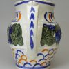 Prattware pottery jug moulded with vine leaves and grapes, circa 1820