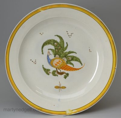 Prattware pottery plate decorated with a pea hen under a pearlware glaze, circa 1820