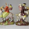 Pair of Staffordshire pearlware figures of the Welsh Tailor and his Wife, circa 1820