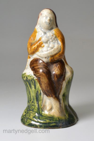 Pearlware pottery figure of a man decorated with colours under the glaze, circa 1800