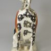 Pearlware pottery cow creamer decorated with colours under the glaze, circa 1820