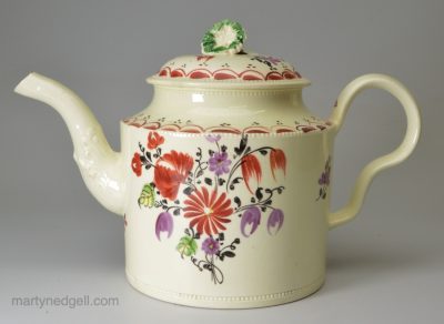 Creamware pottery teapot painted with enamels over the glaze, circa 1770, probably Staffordshire