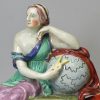 Staffordshire pearlware pottery watch stand with the figure of Urania, circa 1810