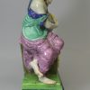 Staffordshire pearlware pottery watch stand with the figure of Urania, circa 1810