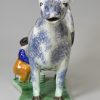 Pearlware pottery cow creamer decorated with colours under the glaze, circa 1820