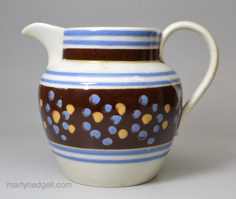 Pearlware pottery jug with mochaware type slip decoration, circa 1840