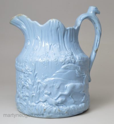 Small relief moulded jug, circa 1850