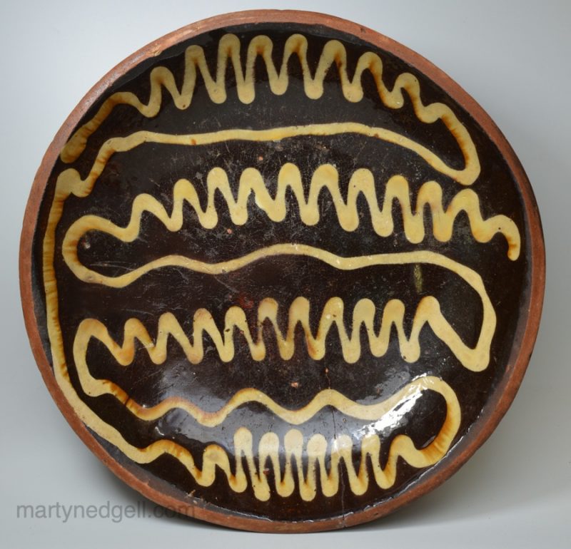 Staffordshire baking dish decorated with trailed slip, circa 1750