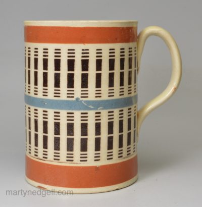 Mochaware mug decorated with inlaid slip, circa 1820