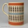 Mochaware mug decorated with inlaid slip, circa 1820